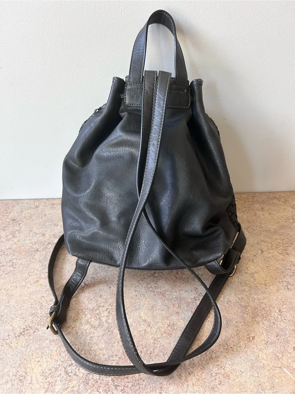 Moda Luxe Black Leather Woven Backpack With Drawstring and Tassles